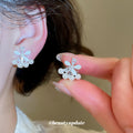 Floral Pearl Clip-On Earrings in Silver and Gold with Polished Metal Details view 4
