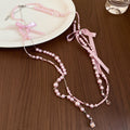 Long Pearl Strand Necklace With Crystal Bow Accents view 7