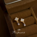 Gold Tone Clear Stone Four Petal Flower Teardrop Stud Earrings view 1
