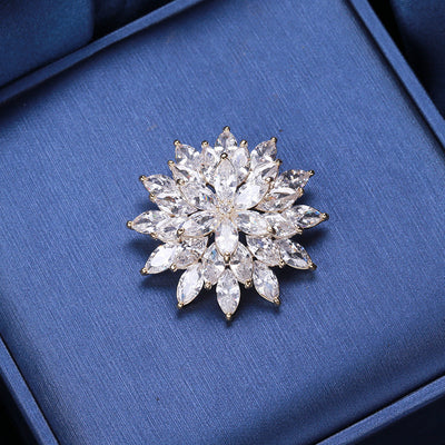 Gold tone clear zircon snowflake flower brooch on blue pad