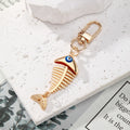 Gold Tone Fish Skeleton Evil Eye Clip Keychains in Five Colors view 6