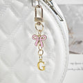 Gold Tone Initial Letter Keychain With Pink Enamel Bow Charm view 12