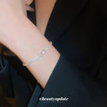 Gold Tone Crystal Slider Bracelet With Pale Pink Rectangular Center Stone view 3
