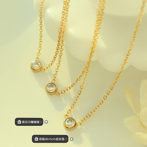 Three gold zircon bezel necklaces flat with zircon and length tags