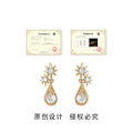Gold Starburst Clear Teardrop Crystal Drop Stud Earrings view 3