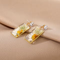 Gold Tone Rectangular Pressed Daisy Resin Stud Drop Earrings view 2