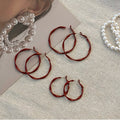 Red Textured Wavy Hoop Earrings in Three Sizes with Detailed Finish view 2