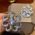 Silver-Tone Open Flower Stud Earrings with Clear Stone Details view 2