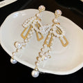 Bow and Pearl Like Bead Tassel Earrings in Gold Tone view 2