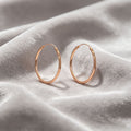 Rose Gold Diamond Cut Textured Thin Oval Hoop Earrings view 6