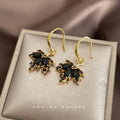 Gold Tone Black Crystal Maple Leaf Drop Earrings On Hooks view 1