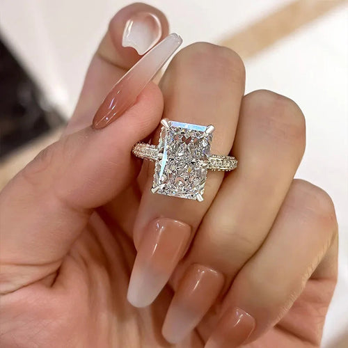 Rectangular clear statement ring worn on a hand
