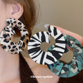 Animal Print Open Circle Fabric Drop Earrings in Three Colors view 1