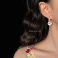 Gold Tone Clear Stone Hook And Iridescent Flower Drop Earrings view 2