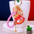 Fortune Pouch Keychains With Enamel Centers and Braided Wrist Straps view 2