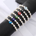 Gold Tone White Bead Colorful Evil Eye Stretch Bracelets view 1