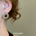 Sculptural Knot Stud Earrings In Gold And Silver Tones view 3