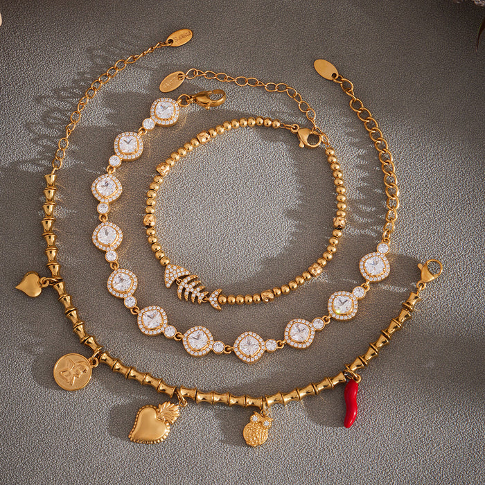 Crystal Station Charm and Fish Skeleton Bracelets in Two Finishes