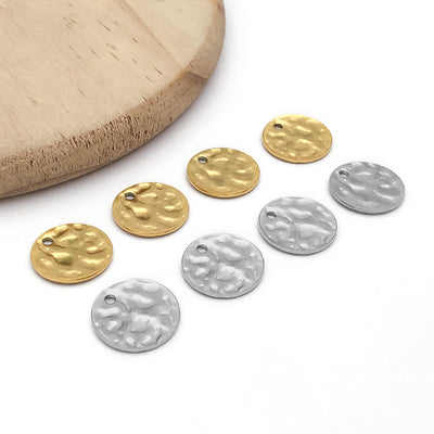 Gold-tone banana charms arranged on a light background