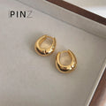 Polished Oval Huggie Hoop Earrings In Gold Silver And Three Sizes view 11