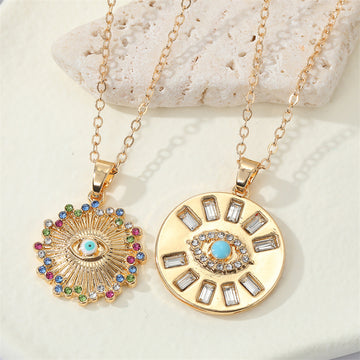 Gold Tone Round Crystal Evil Eye Pendant Necklaces in Two Designs
