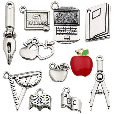 Metallic apple charms pictured with visible surface details
