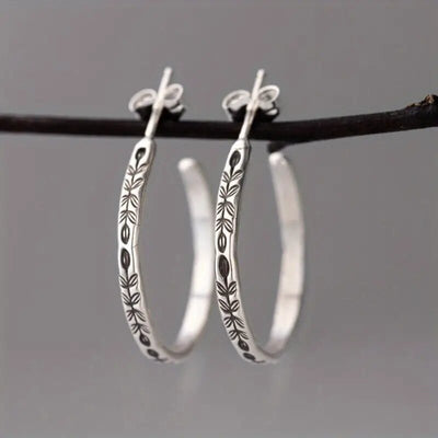 Silver Tone Engraved Feather Hoop Earrings Polished Metal Jewelry alternate close-up view