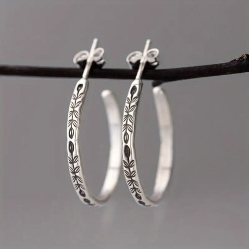 Silver Tone Engraved Feather Hoop Earrings Polished Metal Jewelry alternate close-up view
