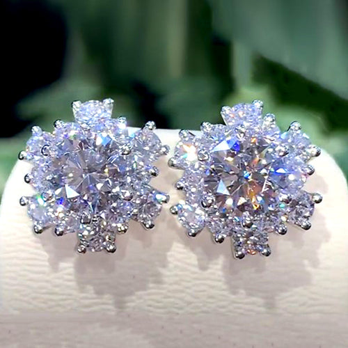Product view showing silver-tone round clear solitaire floral halo stud earrings