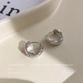 Faceted Sculptural Huggie Hoop Earrings In Gold And Silver Tone view 7