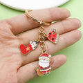 Christmas Charm Keychains Featuring Gold Santa Across 41 Pictured Variations view 3