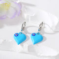 Silver Tone Puffy Heart Evil Eye Huggie Earrings in Five Colors view 2