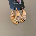 Rounded Ribbed Metal Huggie Hoop Earrings in Two Finishes view 7