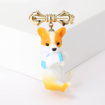 Orange And White Dog Brooch With Bow With Polished Metal Detail
