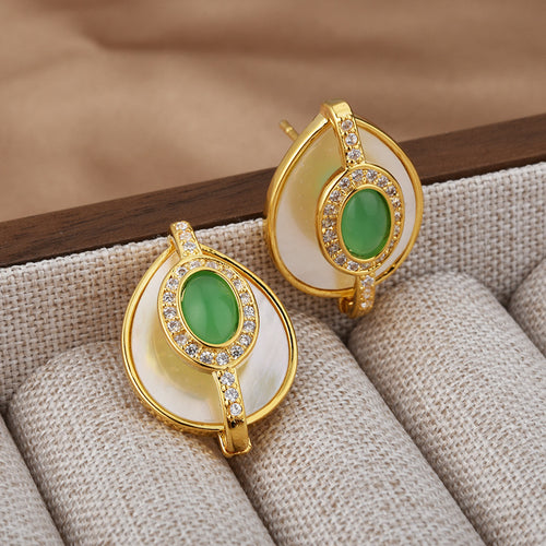 Emerald green cabochon earrings with clear stone accents
