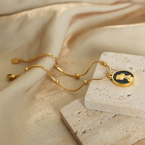 Display view of reversible cameo and apple bracelet in main image 2.