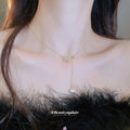 Gold Tone Bow and Pearl Y Necklace with Fine Chain view 3