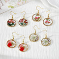 Gold Tone Round Pressed Flower Drop Earrings in Four Designs view 1