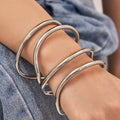 Sculptural Crossing Loop Open Cuff in Gold and Silver Tone view 4