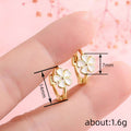 White Enamel Flower Mini Huggie Hoop Earrings Two Tones view 4
