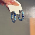 Blue Crystal Textured Hoop Earrings in Silver Tone view 3