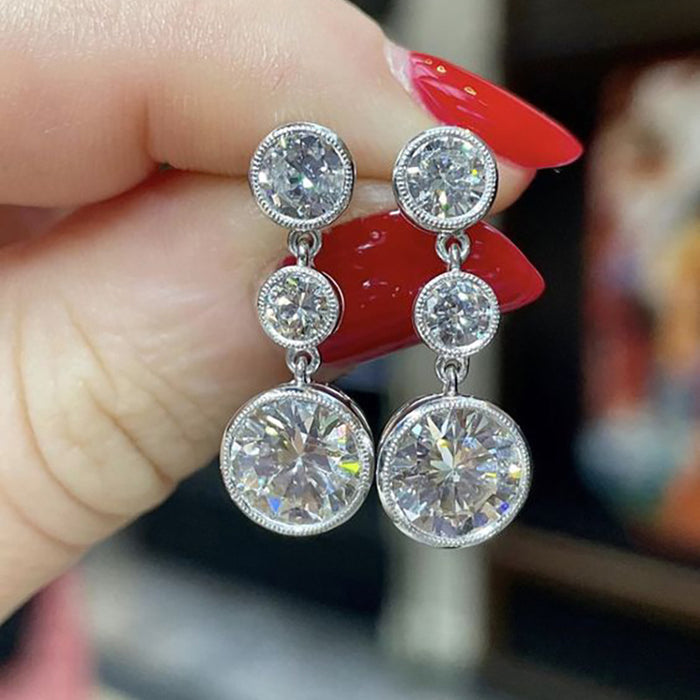 White Metal Triple Round Bezel Clear Drop Earrings Pair