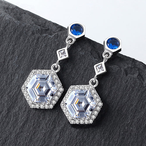 Blue Round Stone and Clear Hexagonal Drop Earrings in Silver Tone shown in product close-up