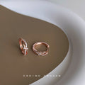 Rose Gold Knot Huggie Hoop Earrings Micro-Set Clear CZ view 2