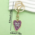 Heart Charm Keychains Featuring White Heart Across 18 Pictured Variations view 9