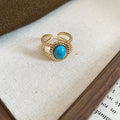 Gold Open Ring Oval Blue Stone Twisted Rope Border view 6