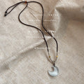 Dark Braided Cord Necklace With White Pearlescent Crescent Pendant view 2