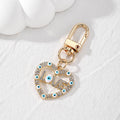 Gold Tone Rhinestone LOVE Heart Evil Eye Clip Keychains view 3