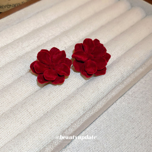 Detail view 2 of red fabric flower and bow statement earrings statement jewelry
