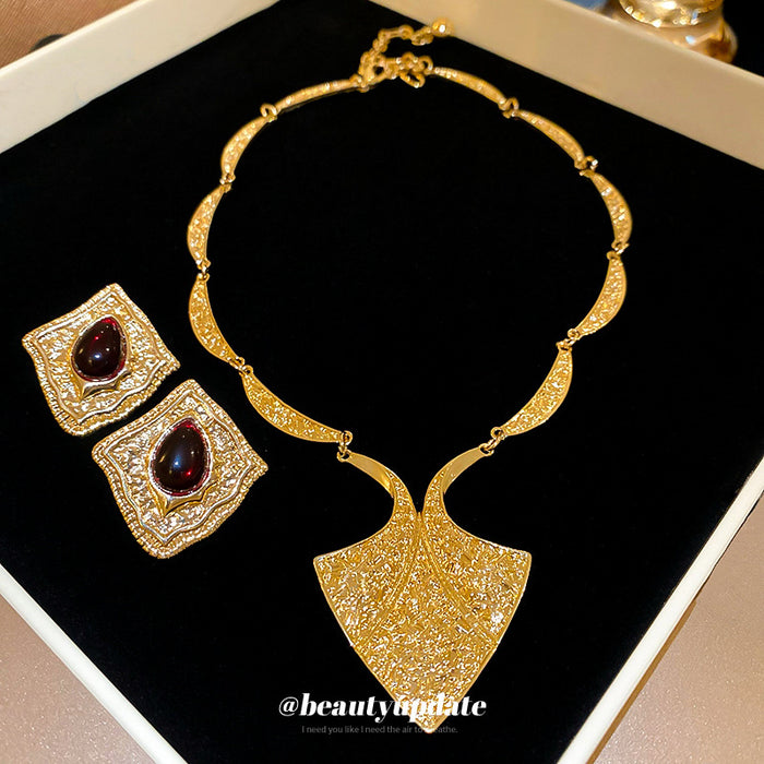 Gold Tone Textured Shield Necklace And Red Teardrop Square Earrings